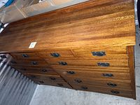 Front and top perspective showing overall design, drawer layout and wood grain