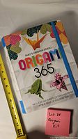 Front cover of Origami 365 book showing colorful origami figures and title.