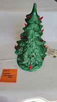Front view of the green ceramic Christmas tree with red plastic bulbs and note stating 'Lot 11 Ceramic Christmas Tree'.