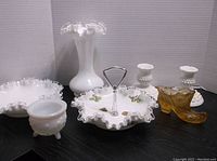 Overview of the lot showing all items: Fenton shoe, vase, candy dish, and candle holders.