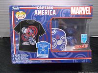 Front view of sealed Funko Pop Marvel Captain America figure and T-shirt box.