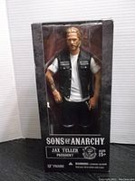Front view of unopened box showing Jax Teller figure in clear window with Sons of Anarchy branding.