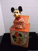 Photo of the vintage Mickey Mouse Jack in the Box toy showing the character figure emerging from the box with the lid open.