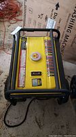 Yellow Champion generator with control panel and safety warnings shown from the top view.
