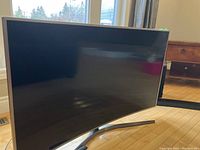 Front view of curved screen with stand