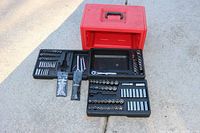 Overview of engine tools including socket sets, wrenches, Allen keys, all organized beside a red three-drawer case.