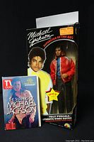 Photo showing Michael Jackson doll in original box and 1992 TV Guide magazine.