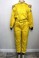 Front view of the full yellow racing suit with belt and elastic cuffs shown on mannequin