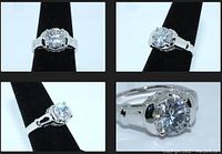 Multiple angles of the sterling silver engagement ring with round cut simulant diamond solitaire and smaller gem accents along the mounting sides.