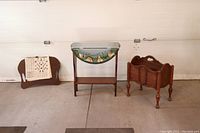 Full view of all three items: magazine rack, folk art table, and lap desk side by side