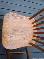 Top view showing contoured solid oak seat with visible grain.