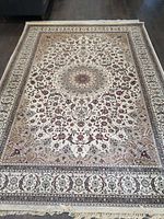 Full view of rectangular rug laid out on floor