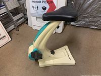Side and angle views of Smooth Fitness Sit n' Cycle exercise bike showing condition, seat, pedals and frame.