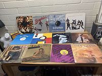 Overview of the 1980s vinyl record collection displayed on a table showing cover arts.