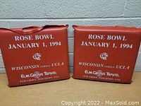 Two vintage red cushions with white text from the 1994 Rose Bowl Wisconsin vs UCLA game, showing front sides with text and rose graphic.