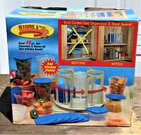 Photo of the boxed Store n Spin 49-piece set showing front with product images and slogan