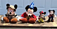 All four Walt Disney World theme park stuffed toys visible in one image