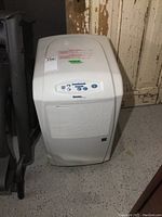 Front view of the Danby Designer dehumidifier showing its vented panel and control button area on top.