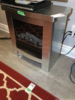 Side angle view showing fireplace dimensions and power cord