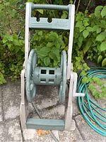 Front view of the Ames ReelEasy hose reel showing the handle, reel, and crank.