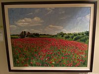 Full view of the framed landscape painting featuring red poppies and a house under cloudy sky.