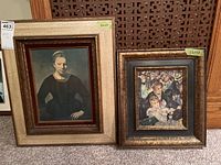 Both framed prints shown side by side on a carpeted floor, with size labels visible on frames.