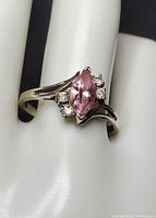 Close-up image showing the 925 silver ring with pink marquise cut stone and four clear cubic zirconia accents.