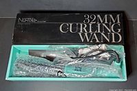 NuTika NuMe 32mm curling wand in teal inside original black box with packaging material.