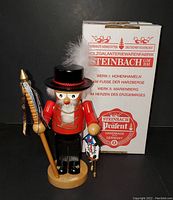 Front view of Steinbach nutcracker with original box showing branding and German text