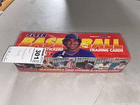 Top view of the sealed boxed set with visible shrink wrap, Fleer brand logo, and 'Baseball' in large yellow and white letters on red background.