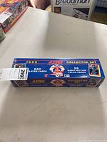 Box of 1989 Score Collector Set sealed in shrink wrap with label showing 660 player cards and 56 Magic Motion trivia cards.