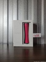 Front view of the packaged Foreo Espada acne treatment device showing the pink device in white box.
