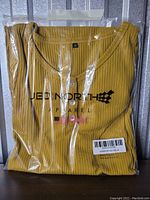 Original packaging of a JED NORTH women's shirt in yellow ribbed fabric, size small, with buttons on front.