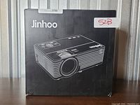 Front view of the Jinhoo projector box showing the brand name and product illustration.