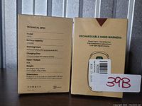 Photo of two boxes of rechargeable hand warmers showing technical specs and packaging details.