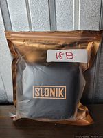 SLONIK headlamp in sealed branded packaging, labeled '18B'