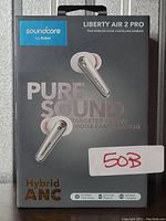 Front of box showing Soundcore Liberty Air 2 Pro earbuds packaging with branding and key features: Pure Sound, Hybrid ANC, wireless charging.