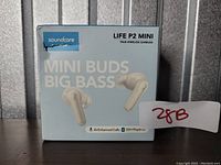 Front of the sealed retail box for Soundcore Life P2 Mini true wireless earbuds, showing branding, product name, key features including 'Mini Buds Big Bass,' AI Enhanced Calls, and 32H Playtime.
