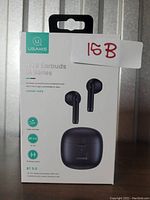 Front image of the USAMS TWS Earbuds IA Series box showing earbuds and charging case in black color, with branding and key features on front.