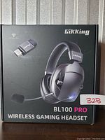 Front view of the GikKing BL100 Pro wireless gaming headset box showing headset and USB wireless receiver image.