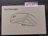 Photo of the eye massager box with product line drawing and label '45A'.