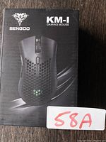Photo of the BENGOO KM-1 gaming mouse box showing brand and model.