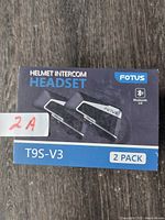 Front image of FOTUS T9S-V3 helmet intercom headset 2-pack box, showing product and brand name
