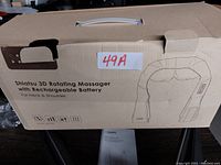 Box packaging of Naipo Shiatsu 3D Rotating Massager with Rechargeable Battery for neck and shoulder, showing product name and line drawing of massager.