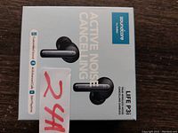 Top view of the earbud box showing product name, image of earbuds, and features including active noise cancelling and Bluetooth 5.0.