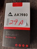 Box of AK1980 sport bracelet mentioning fitness tracker designed in Hong Kong.