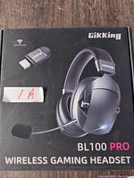 Front of the box showing Gikking BL100 PRO Wireless Gaming Headset with USB dongle image.