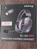Front of box showing the GikKing BL100 PRO wireless gaming headset and USB wireless receiver