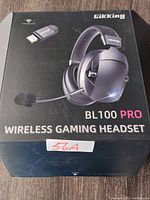 Retail box front showing image of the Gikking BL100 Pro wireless gaming headset and USB transmitter, model clearly visible.