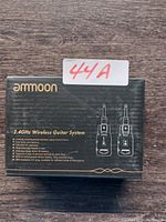 Front view of Ammoon 2.4GHz Wireless Guitar System box showing brand and product image with 44A sticker.